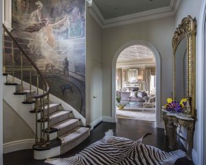 A penthouse entry foyer looking into the living room